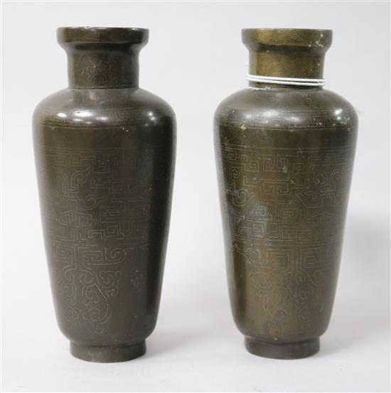 A pair of Chinese bronze and silver wire inlaid vases, c.1900
